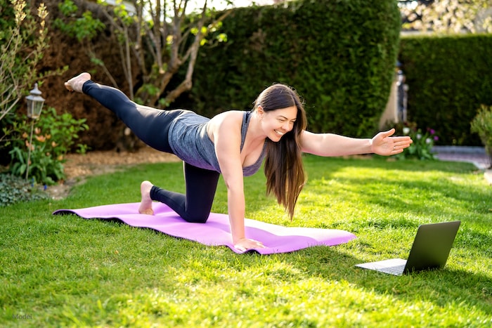 Woman exercising outside to maintain her body contouring results.